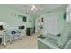A bonus room features tile flooring, large closet, and an open door to the home's interior at 12821 5Th Isle, Hudson, FL 34667