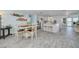 Bright dining area showcasing modern decor and an open layout connecting to the kitchen at 12821 5Th Isle, Hudson, FL 34667