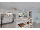 Bright kitchen with stainless steel appliances, barstool seating, and ample counter space at 12821 5Th Isle, Hudson, FL 34667
