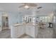 Open kitchen with island, breakfast nook, and luxury vinyl plank flooring at 12821 5Th Isle, Hudson, FL 34667