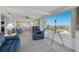 Bright sunroom with large windows offering panoramic views, perfect for relaxation and enjoying the scenery at 12821 5Th Isle, Hudson, FL 34667