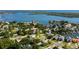 Aerial view of a residential area, showcasing a home surrounded by lush greenery and waterways at 1836 Bayou Grande Ne Blvd, St Petersburg, FL 33703