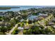 Overhead view of home, showcasing proximity to a beautiful blue bay and neighborhood, surrounded by lush greenery at 1836 Bayou Grande Ne Blvd, St Petersburg, FL 33703