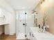 Bathroom with glass enclosed shower and vanity with white countertop at 1908 Sutherland W Dr, Palm Harbor, FL 34683