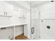 Bathroom featuring white cabinets and walk-in shower at 1908 Sutherland W Dr, Palm Harbor, FL 34683