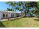 Large backyard with a patio and covered pergola that is perfect for outdoor living and entertaining at 201 S Treasure E Dr, Tampa, FL 33609