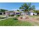 Appealing single Gathering home featuring mature landscaping, a charming walkway, and a covered parking area at 201 S Treasure E Dr, Tampa, FL 33609