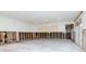 Open-concept living room with concrete floors and door leading to the outside at 201 S Treasure E Dr, Tampa, FL 33609