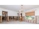 Living room with elegant chandelier, large window, and classic detailing at 201 S Treasure E Dr, Tampa, FL 33609
