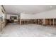 Spacious living room with light walls and floors. Needs repairs at 201 S Treasure E Dr, Tampa, FL 33609