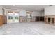 Spacious living room featuring french doors, a window, and concrete floors at 201 S Treasure E Dr, Tampa, FL 33609