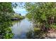Tranquil canal view showing neighborhood docks and mangrove trees that provide privacy at 201 S Treasure E Dr, Tampa, FL 33609