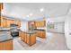 Open concept kitchen featuring an island, stainless appliances, and sleek countertops at 204 7Th Nw Ave, Ruskin, FL 33570