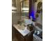 Bathroom with a wooden vanity and a decorative mirror at 2110 Oakley S Ave, St Petersburg, FL 33712