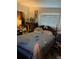 A bedroom with a large bed and a window with blinds lets in natural light at 2110 Oakley S Ave, St Petersburg, FL 33712