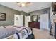 Spacious bedroom featuring a fireplace, dark wood dresser, and multiple doorways leading to other rooms at 2676 Tanglewood Trl, Palm Harbor, FL 34685