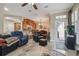 Open floor plan showcasing living room with tile floors and open access to dining room and kitchen at 2676 Tanglewood Trl, Palm Harbor, FL 34685