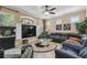 Living room featuring a neutral color scheme, tile flooring, and a built in entertainment center at 2676 Tanglewood Trl, Palm Harbor, FL 34685