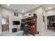 A home office with custom shelving, a large desk, and neutral walls is great for working from home at 2676 Tanglewood Trl, Palm Harbor, FL 34685