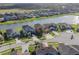Beautiful aerial shot featuring homes in a lakeside community with lush green surroundings at 28923 Lucero Ln, Wesley Chapel, FL 33543