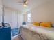 Bright bedroom with ceiling fan, and closet providing a comfortable living space at 28923 Lucero Ln, Wesley Chapel, FL 33543