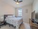 Inviting bedroom with natural light, ceiling fan and modern decor offers a comfortable retreat at 28923 Lucero Ln, Wesley Chapel, FL 33543