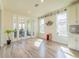 Bright dining area featuring large windows, a stylish wine rack, and views into the office at 28923 Lucero Ln, Wesley Chapel, FL 33543