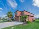 Two-story home with a two car garage, a landscaped yard, and a well-manicured lawn at 28923 Lucero Ln, Wesley Chapel, FL 33543