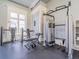 Bright gym with various weight machines and neutral wall colors at 28923 Lucero Ln, Wesley Chapel, FL 33543