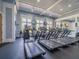 Community gym featuring multiple treadmills, televisions and ample sunlight from the many windows at 28923 Lucero Ln, Wesley Chapel, FL 33543