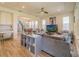 Open-concept living room with modern furnishings, access to the dining area, and natural light at 28923 Lucero Ln, Wesley Chapel, FL 33543