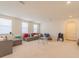 Bright and airy living room with comfortable seating, neutral tones, and ample space at 28923 Lucero Ln, Wesley Chapel, FL 33543