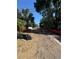 Outdoor view of a residential vacant lot, ready for construction and landscaping with mature surrounding trees at 3319 W Marlin Ave, Tampa, FL 33611