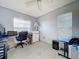 Functional bedroom featuring a desk, chair, and ample natural light from multiple windows at 3914 41St W St, Bradenton, FL 34205