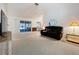 Bright living room featuring neutral carpet, a sliding glass door, and comfortable seating at 3914 41St W St, Bradenton, FL 34205
