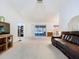 Bright living room featuring neutral carpet, a sliding glass door, and comfortable seating at 3914 41St W St, Bradenton, FL 34205