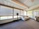 Bright sunroom with large windows, seating, overhead lighting, and potential for relaxation and entertainment at 3914 41St W St, Bradenton, FL 34205