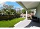 Spacious backyard featuring green grass, mature trees, and outdoor seating at 4036 56Th N Ave, St Petersburg, FL 33714