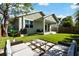 Backyard featuring green grass, outdoor seating, and a covered patio at 4036 56Th N Ave, St Petersburg, FL 33714