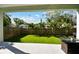 View of lush backyard oasis with manicured lawn and tropical landscaping, perfect for outdoor enjoyment at 4036 56Th N Ave, St Petersburg, FL 33714