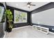 Soundproof bonus room with black walls, light-colored flooring, and a large window at 4036 56Th N Ave, St Petersburg, FL 33714