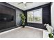 Soundproof bonus room with dark walls, light-colored flooring, and a large window at 4036 56Th N Ave, St Petersburg, FL 33714