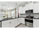 Modern kitchen featuring stainless steel appliances, sleek countertops, and bright white cabinetry at 4036 56Th N Ave, St Petersburg, FL 33714