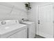 Laundry room features a washing machine, dryer and access to the back yard at 4036 56Th N Ave, St Petersburg, FL 33714