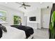 Spacious main bedroom with backyard access and an adjacent full bathroom at 4036 56Th N Ave, St Petersburg, FL 33714