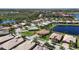 Beautiful aerial view of a residential community with lakes and lush green landscaping surrounding single-Gathering homes at 5073 Stone Harbor Cir, Wimauma, FL 33598