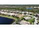 Panoramic aerial view of single-Gathering homes, lakes and green landscaping in a beautiful residential community at 5073 Stone Harbor Cir, Wimauma, FL 33598