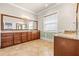 Large bathroom featuring double sinks, granite countertops, and tile flooring at 5073 Stone Harbor Cir, Wimauma, FL 33598