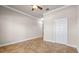 Bedroom featuring neutral walls, tile flooring, ceiling fan, and natural light at 5073 Stone Harbor Cir, Wimauma, FL 33598