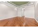 Large bedroom featuring hardwood floors, decorative ceilings, and recessed lighting at 5073 Stone Harbor Cir, Wimauma, FL 33598